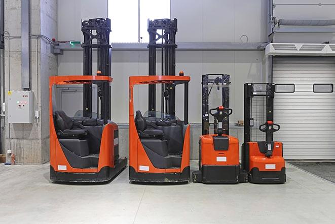 forklifts transporting goods in a warehouse